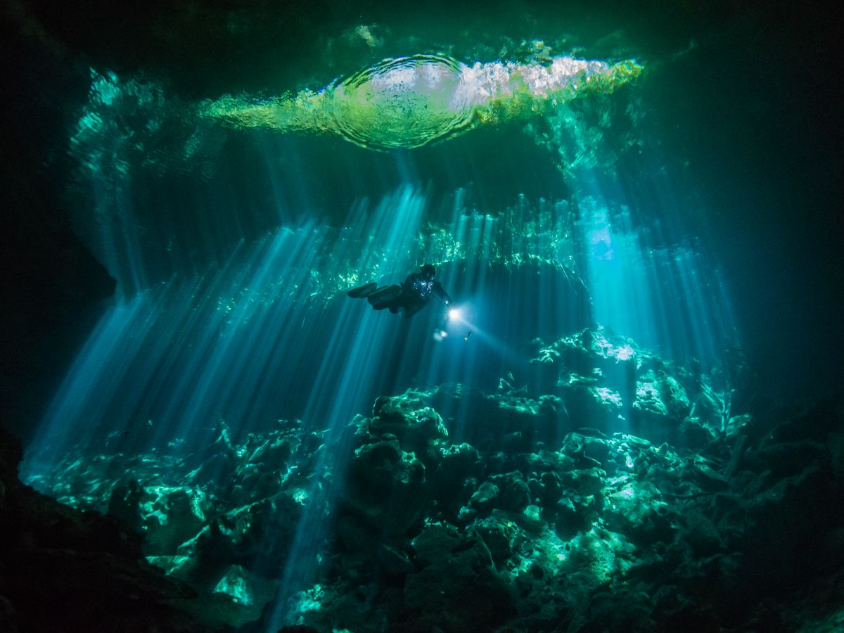Diver exploring Cenote Ponderosa in Mexico