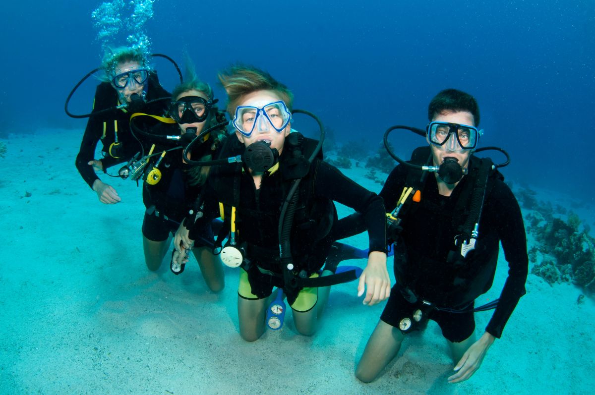 Group of scuba divers underwater