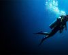 Scuba diver underwater with lots of bubbles around them
