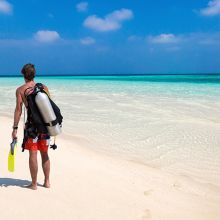 Guy shore diving in the Maldives