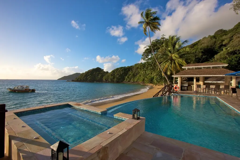 View of the sea & swimming pool at Blue Waters Inn in Tobago