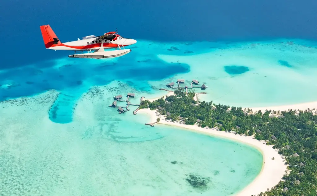 Sea plane over an island in the Maldives