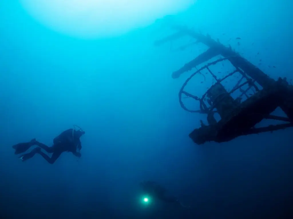 Divers exploring a wreck in Egypt, the Red Sea