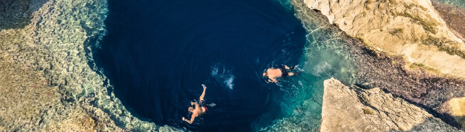 Snorkellers in the Blue Hole, Gozo