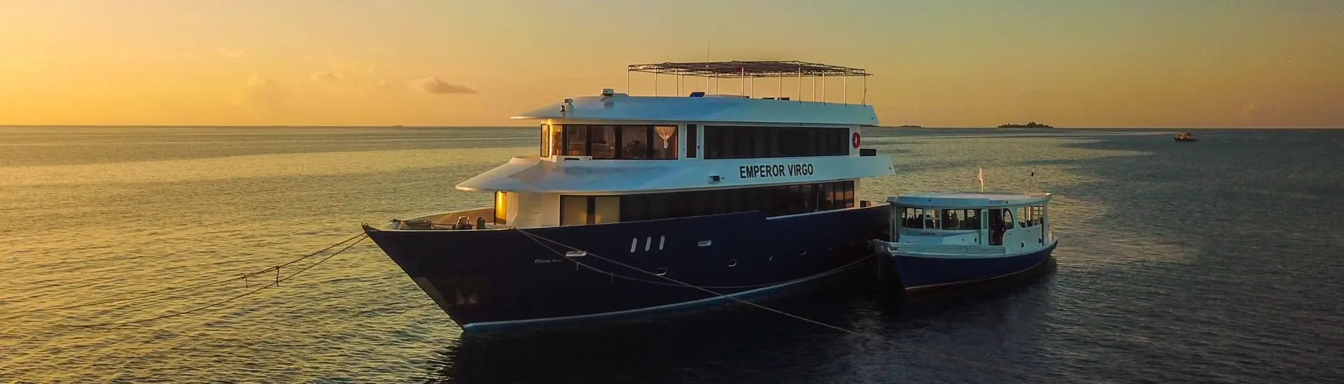 Emperor Virgo liveaboard at sunset in the Maldives
