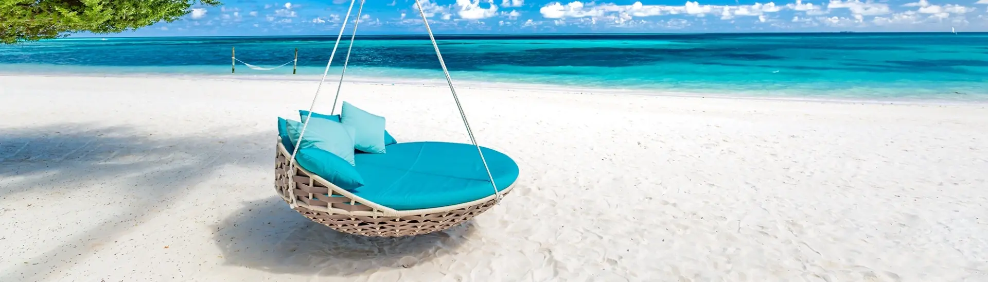 Hanging chair on a beach in the Maldives