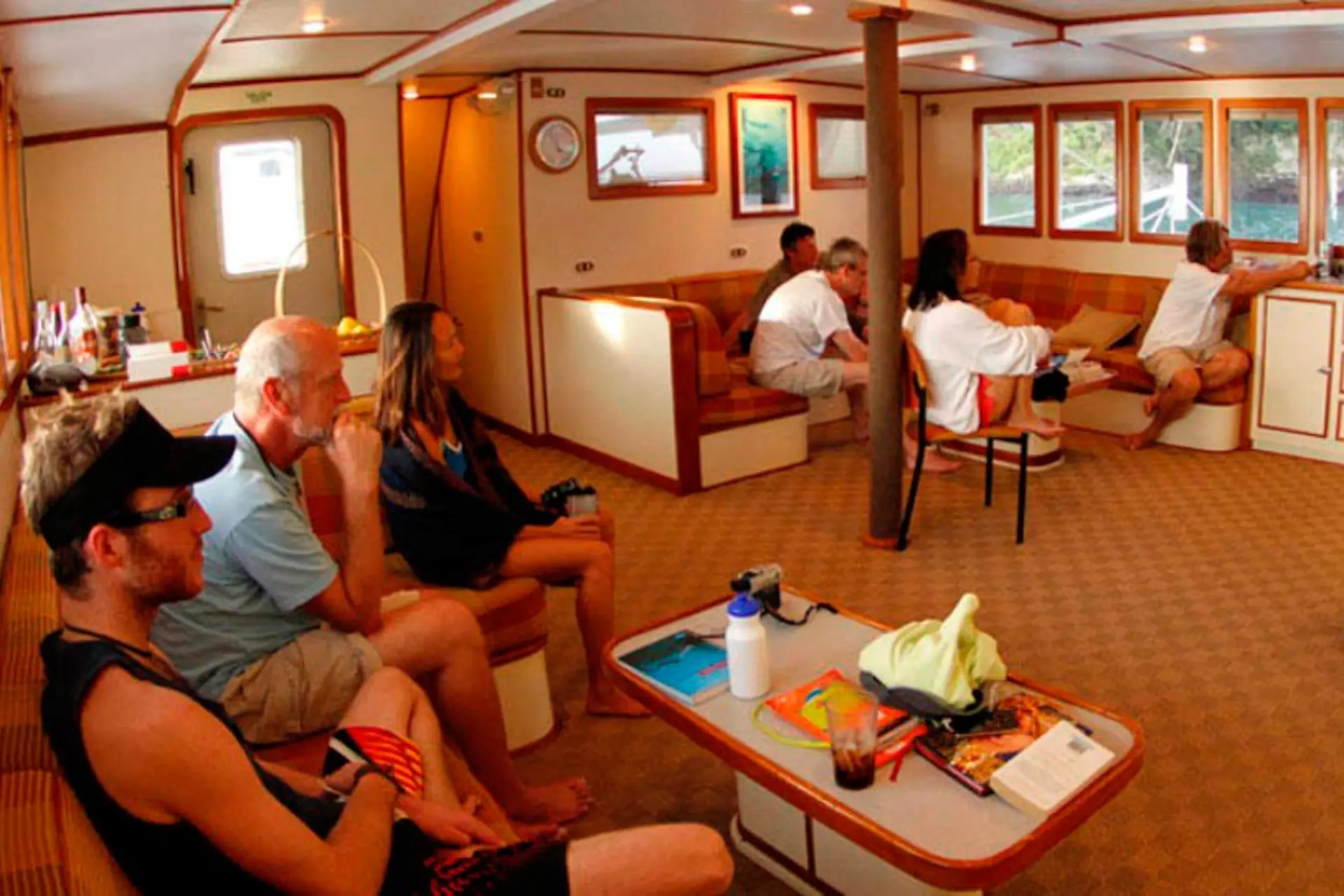Guests in the salon area on Sea Hunter.