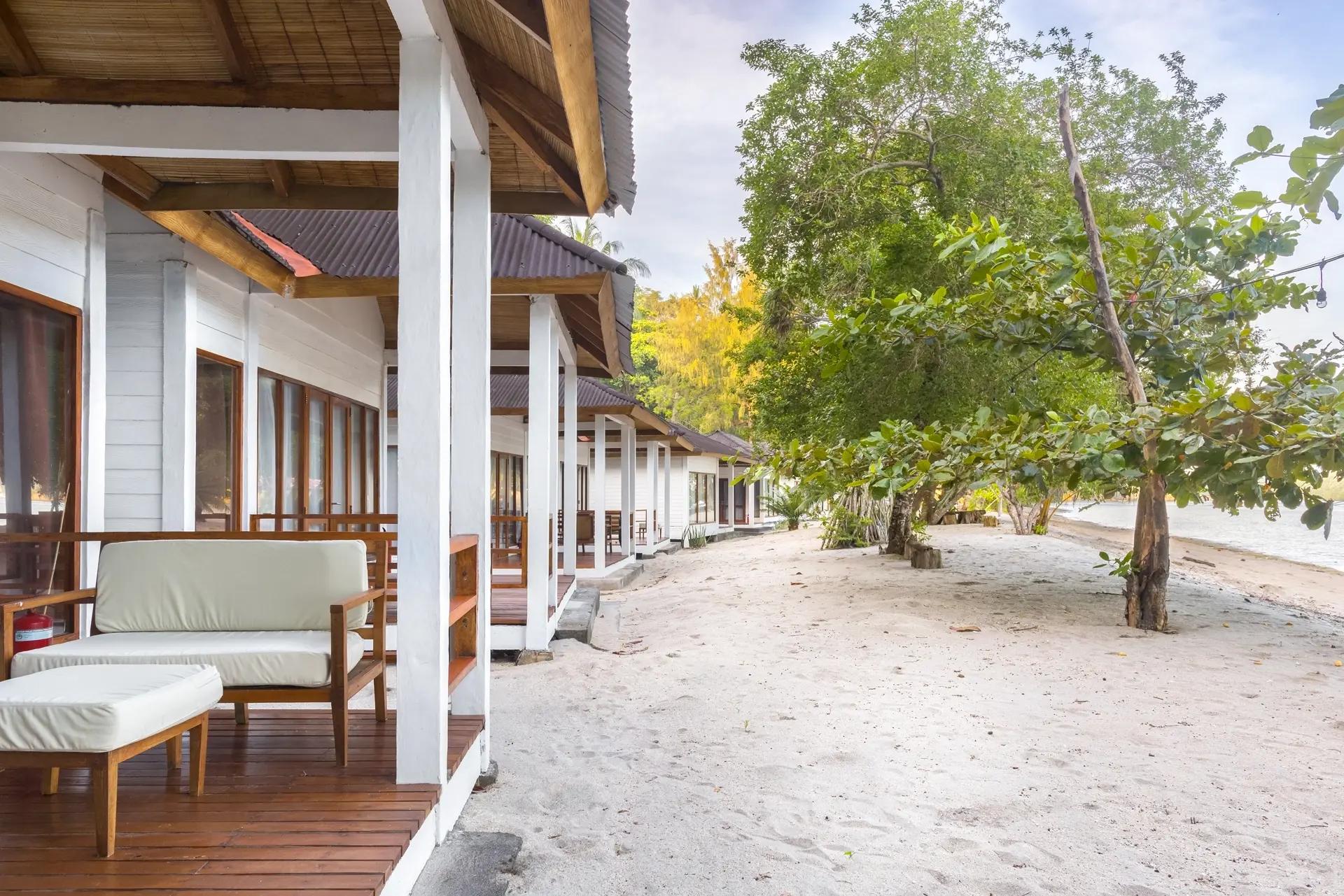 Oceanfront cottages & beach at White Sands Beach Resort in Lembeh, Indonesia