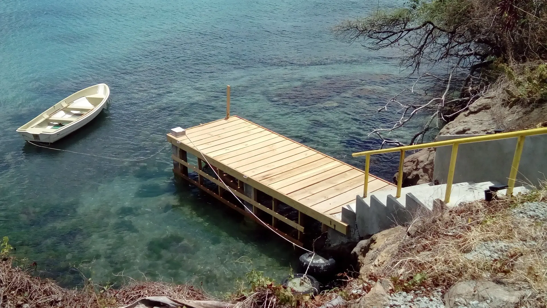 Dinghy dock & boat at Green Roof Inn in the Caribbean island of Carriacou