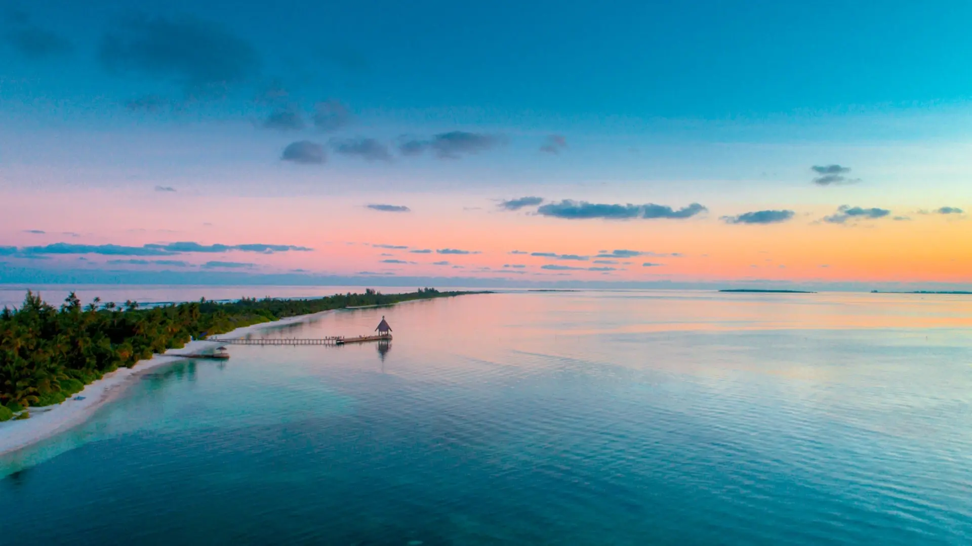 Aerial of Canareef Resort in the Maldives at sunset