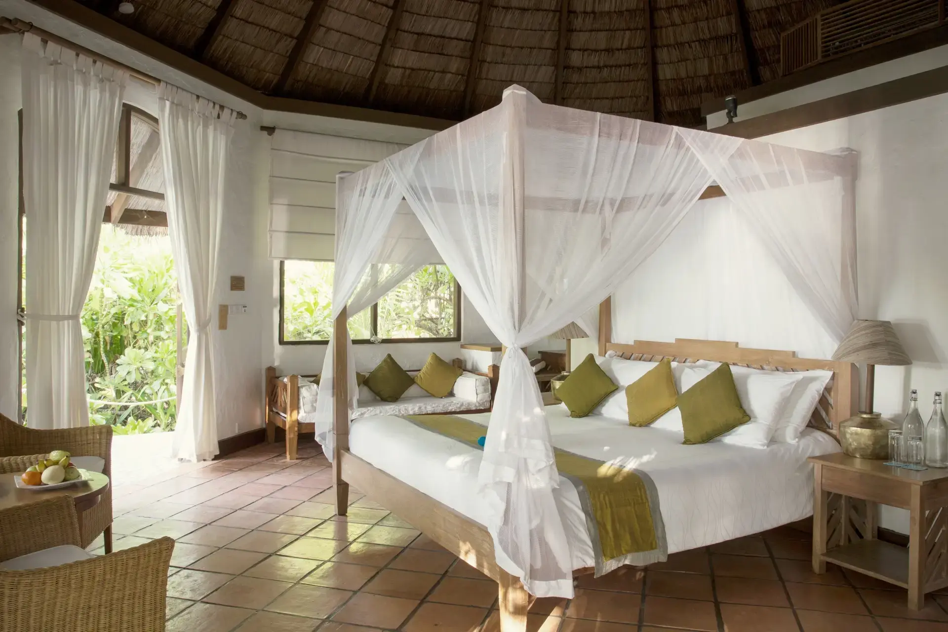 View of a bedroom in a deluxe pool villa, at Coco Palm Dhuni Kolhu Resort, Maldives