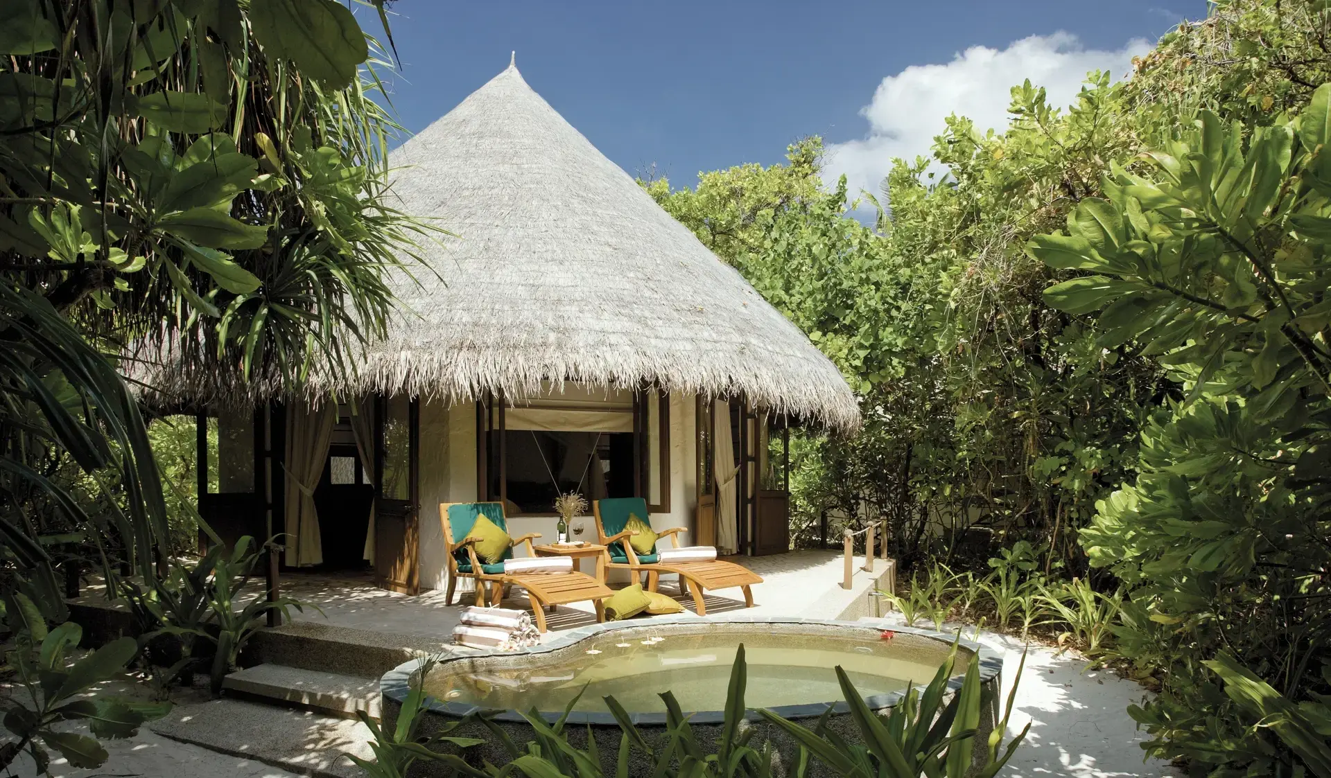 Exterior of a deluxe villa at Coco Palm Dhuni Kolhu Resort, Maldives