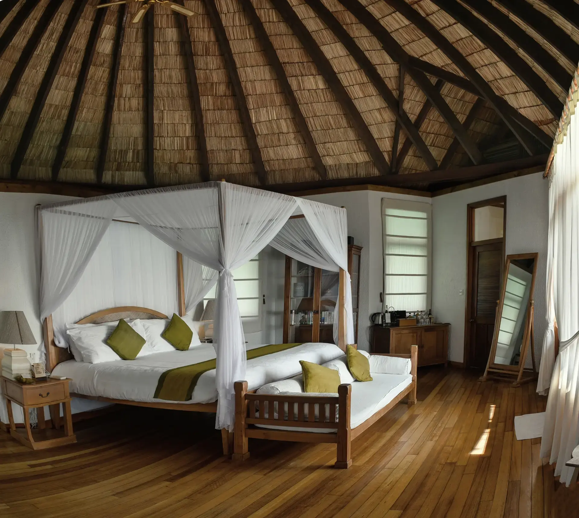 View of a lagoon villa bedroom, at Coco Palm Dhuni Kolhu Resort, Maldives