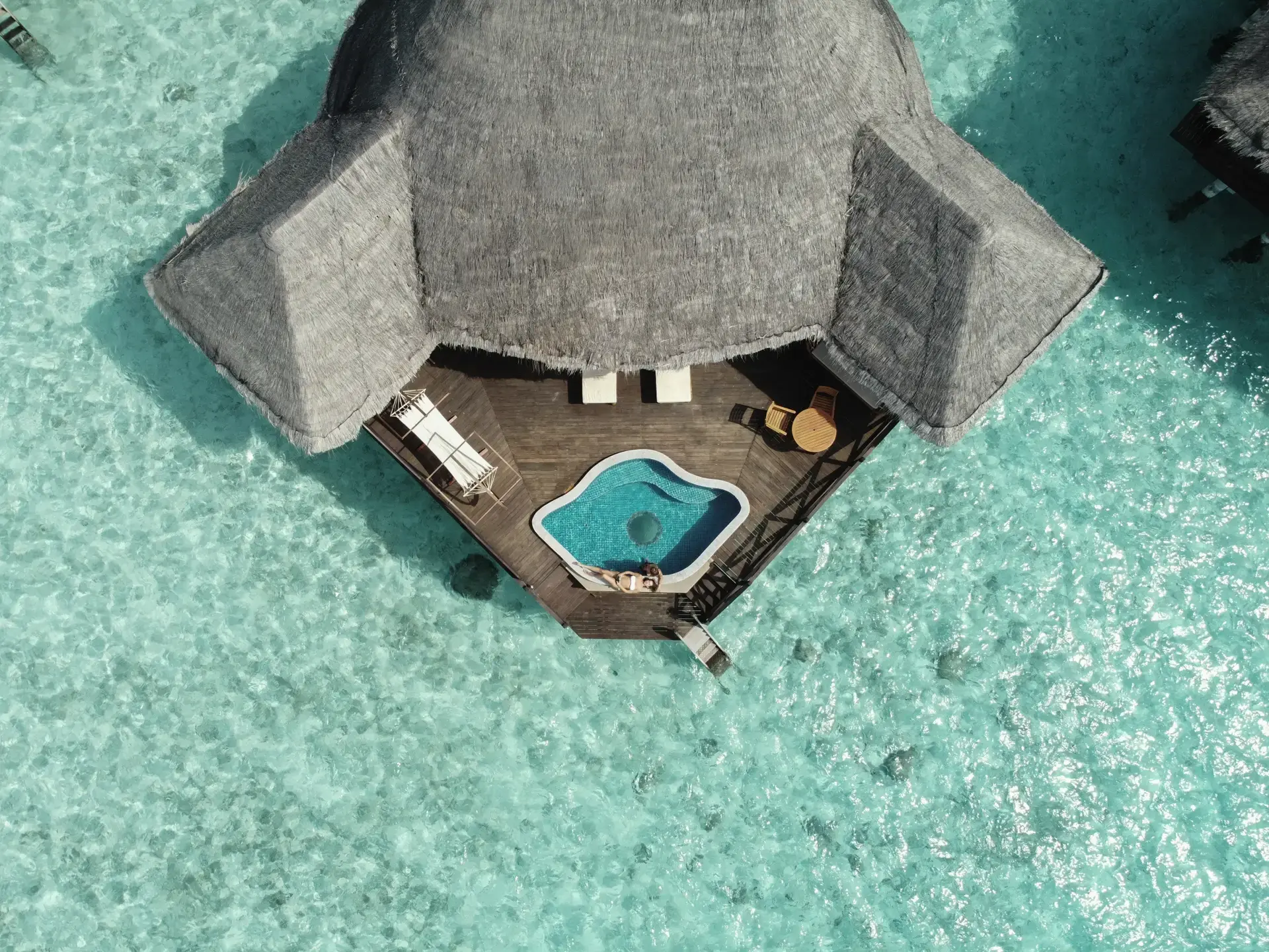 Aerial view of a sunset lagoon villa, at Coco Palm Dhuni Kolhu Resort, Maldives