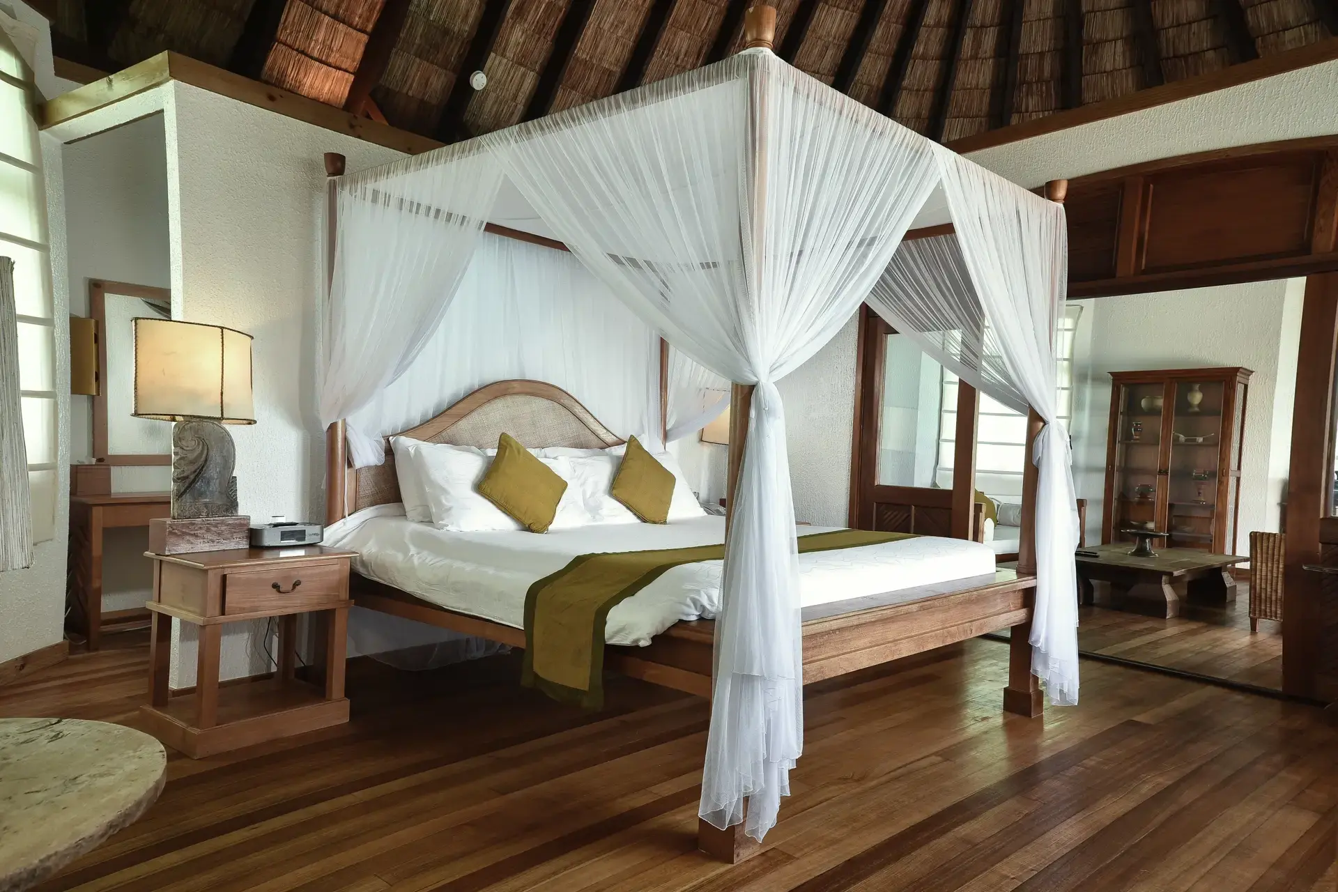View of a sunset lagoon villa bedroom, at Coco Palm Dhuni Kolhu Resort, Maldives