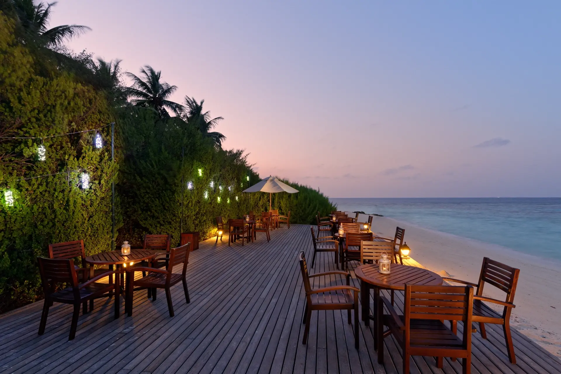 Bar deck at sunset at Embudu Village accommodation in the Maldives