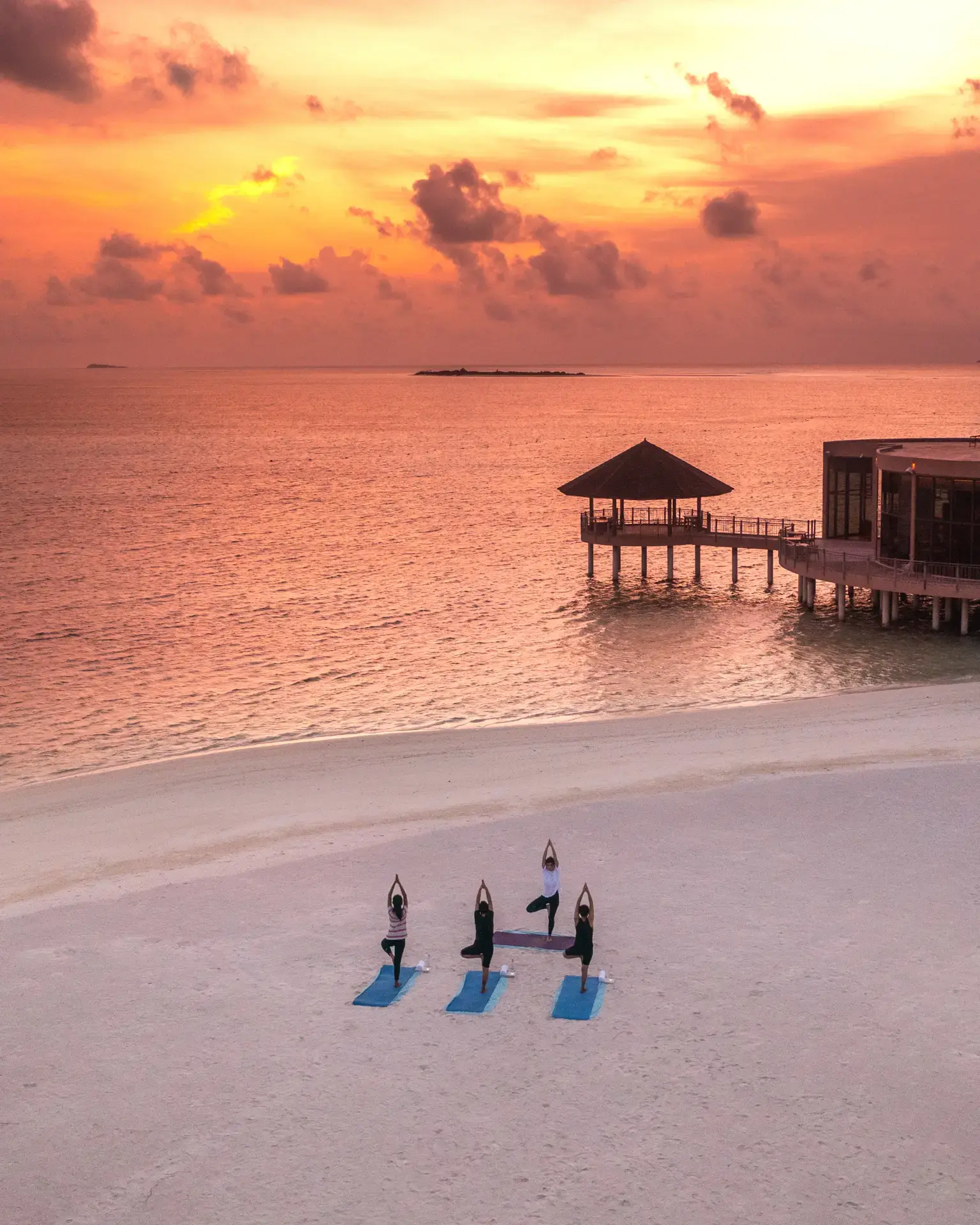 Sunset yoga at Le Meridien Maldives Resort & Spa, Maldives.