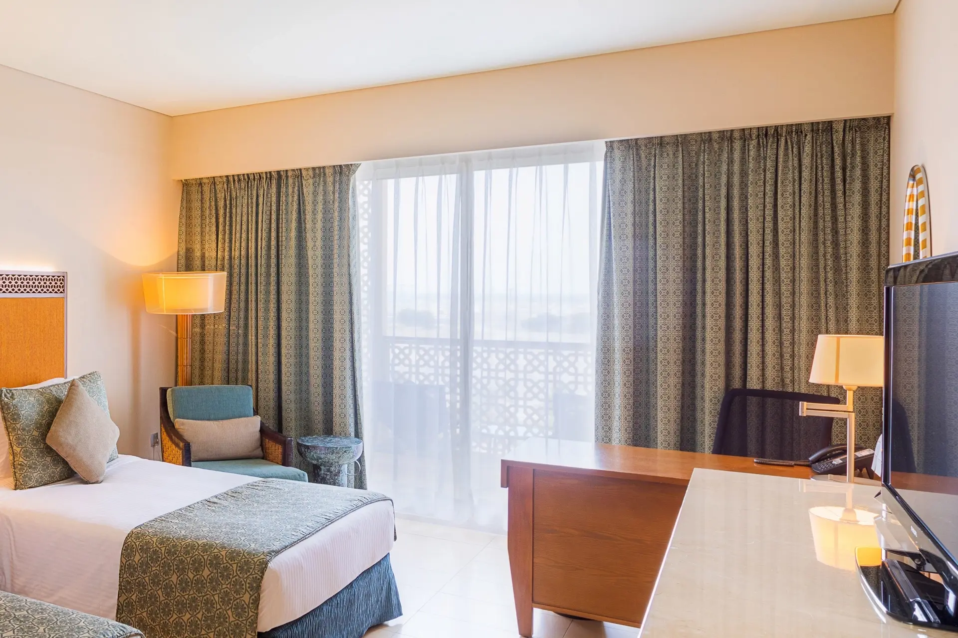 Deluxe bedroom at Barcelo Mussanah Resort in Oman