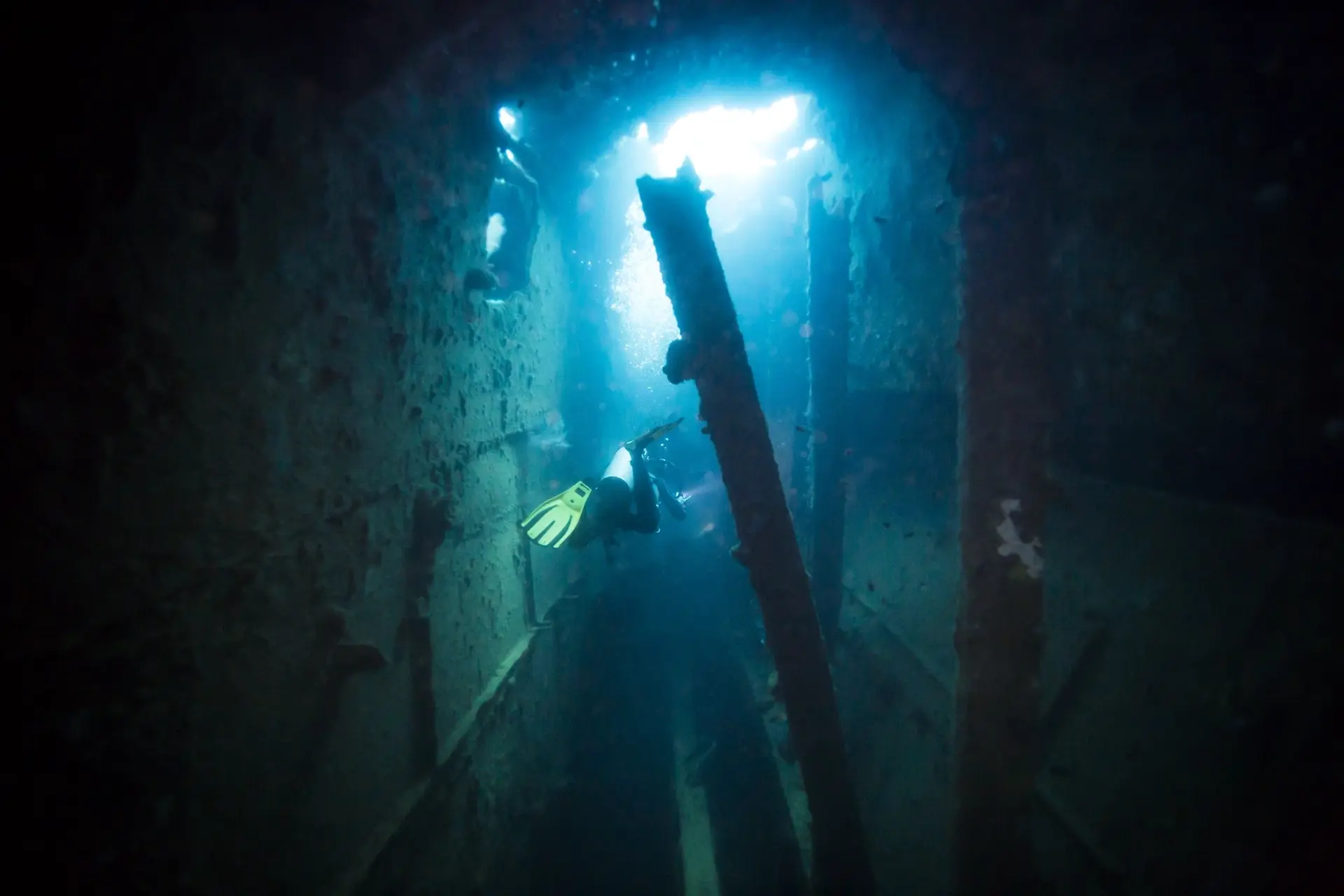 Diver exploring a World War II shipwreck in Coron, the Philippines