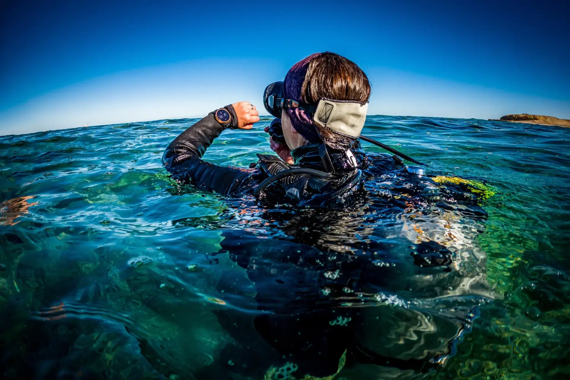Diver checking dive computer