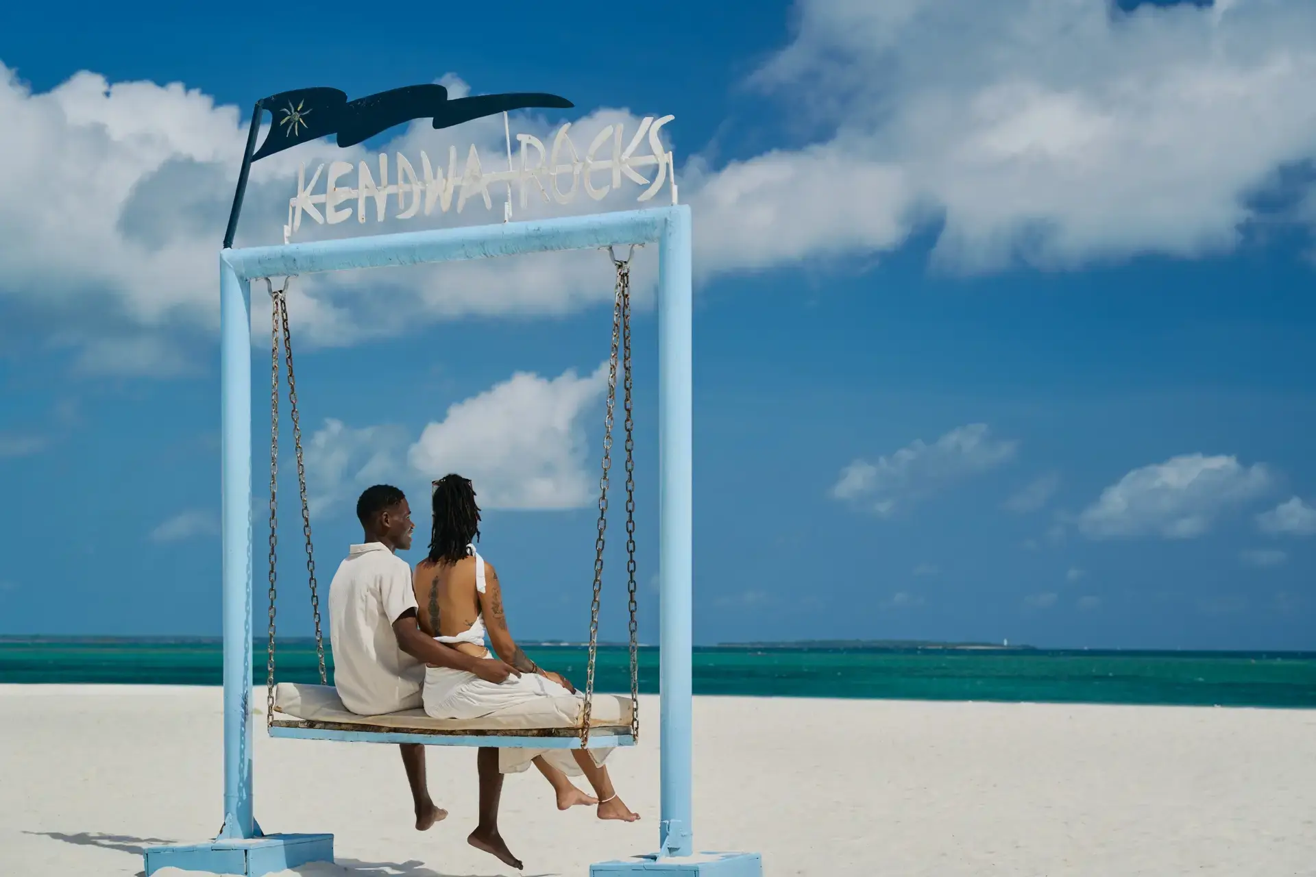 Guests on a swing at the beach, Kendwa Rocks Beach Hotel, Zanzibar