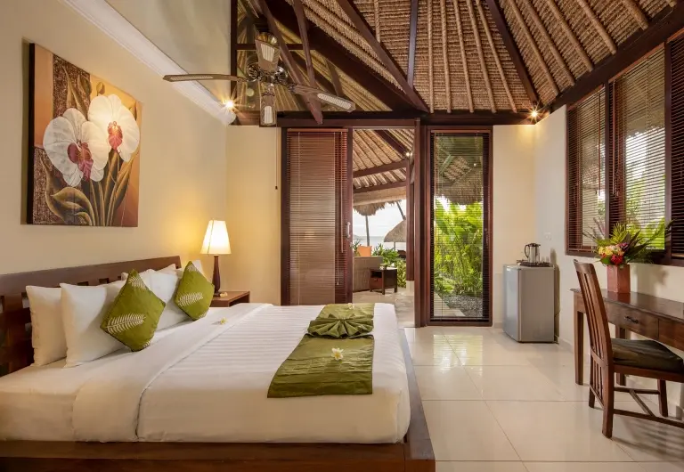 Double bedroom at Alam Anda Ocean Front Resort & Spa in Bali, Indonesia