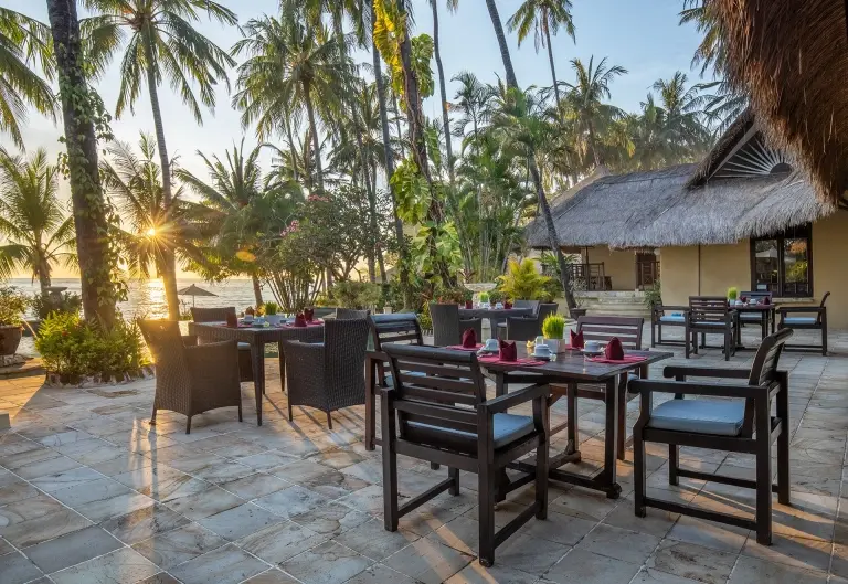 Outdoor dining area at Alam Anda Ocean Front Resort & Spa in Bali, Indonesia