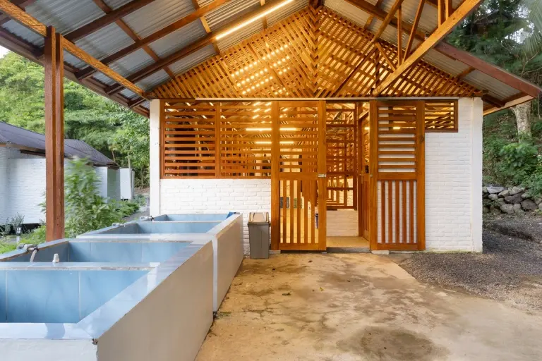 Rinse tanks outside the dive centre at White Sands Beach Resort in Lembeh, Indonesia