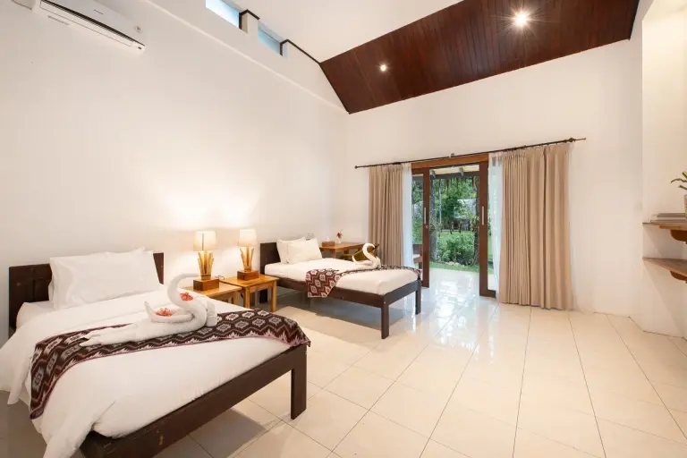 Deluxe cottage bedroom at Murex Manado Resort in Indonesia