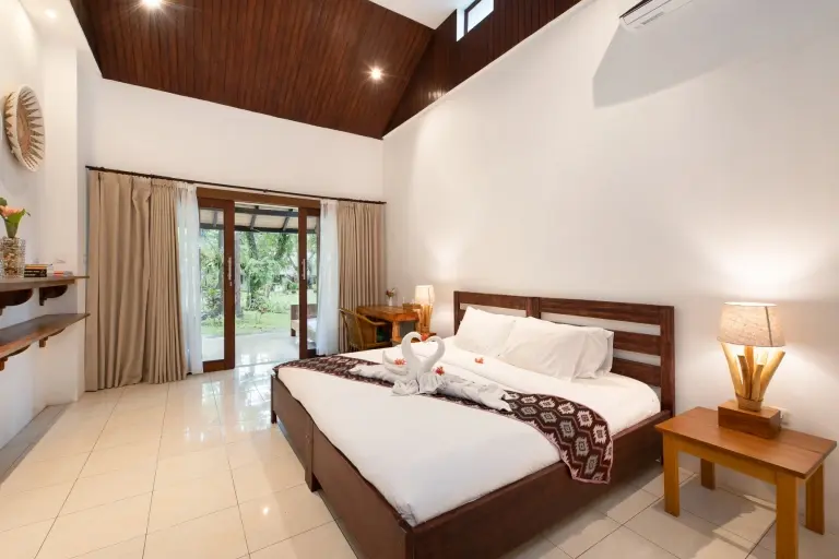 Deluxe cottage bedroom at Murex Manado Resort in Indonesia