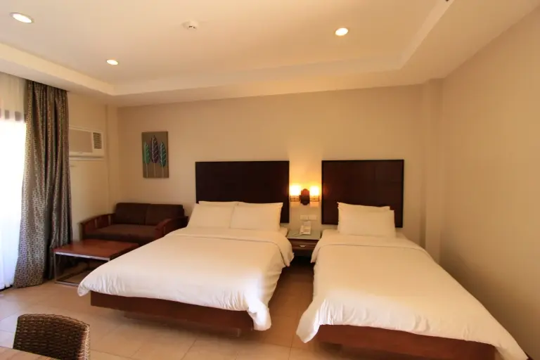 Twin beds at Westown Lagoon in Coron, the Philippines