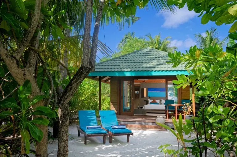 Sunset beach villa at Canareef Resort in the Maldives