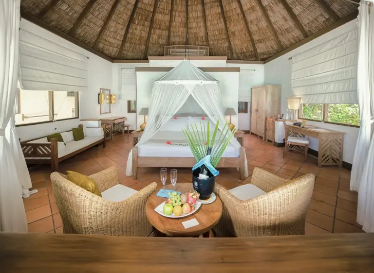 View of a beach villa bedroom, at Coco Palm Dhuni Kolhu Resort, Maldives
