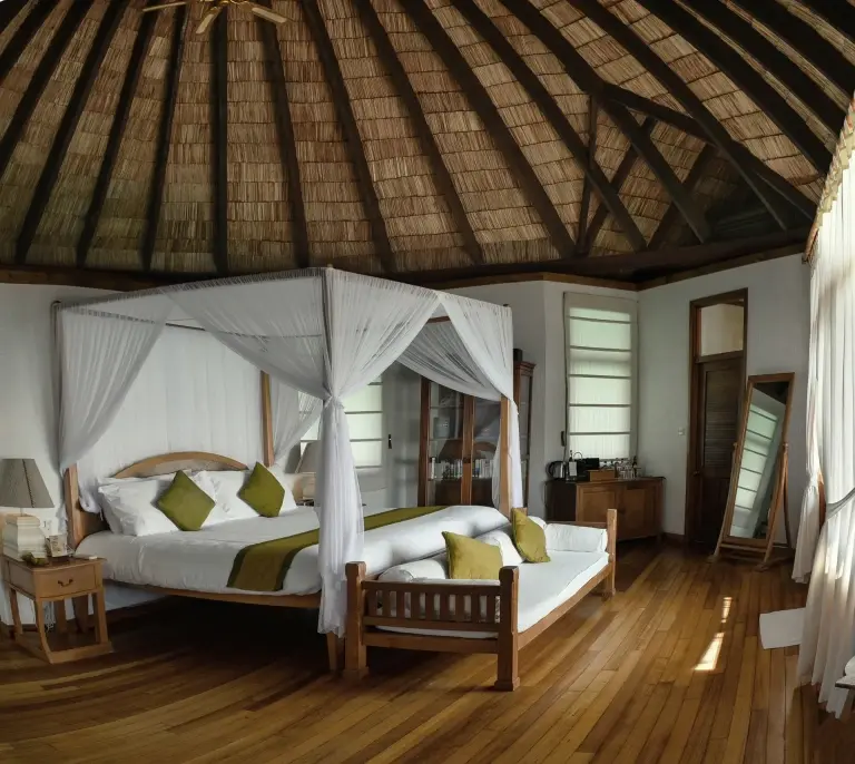 View of a lagoon villa bedroom, at Coco Palm Dhuni Kolhu Resort, Maldives