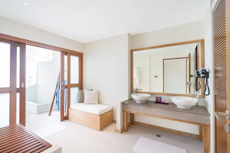 Water bungalow bathroom at Ellaidhoo Maldives by Cinnamon Resort in the Maldives