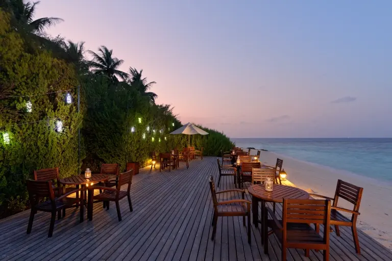 Bar deck at sunset at Embudu Village accommodation in the Maldives