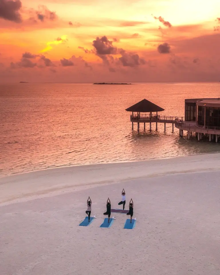 Sunset yoga at Le Meridien Maldives Resort & Spa, Maldives.