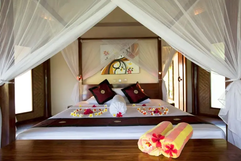 AC bungalow bedroom at Alam Batu in Bali, Indonesia