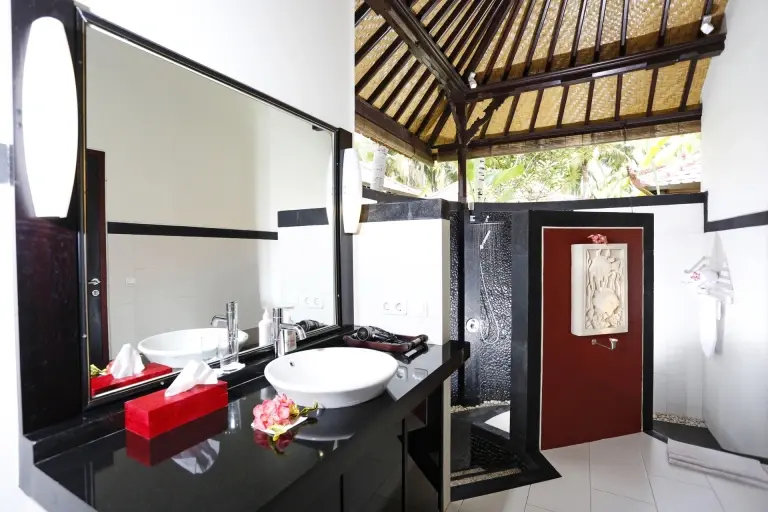 Bungalow bathroom at Teluk Karang Resort in Bali, Indonesia