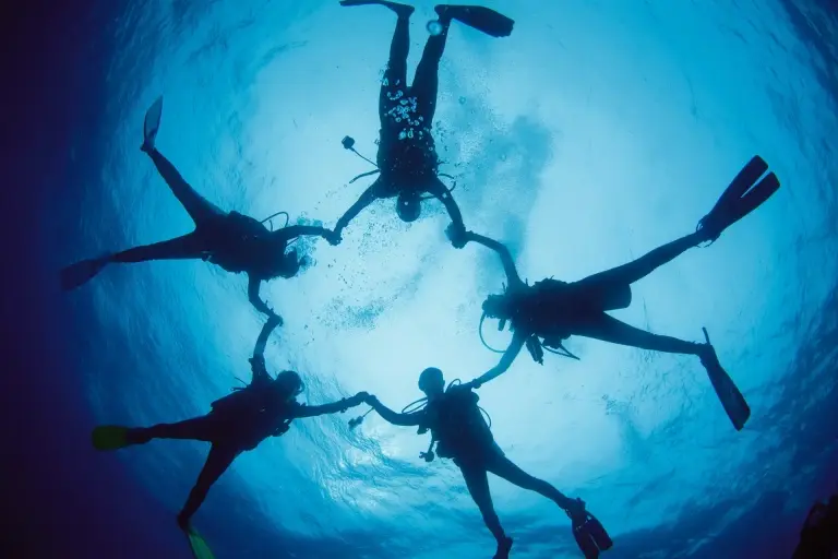 Divers in a star position in Thailand