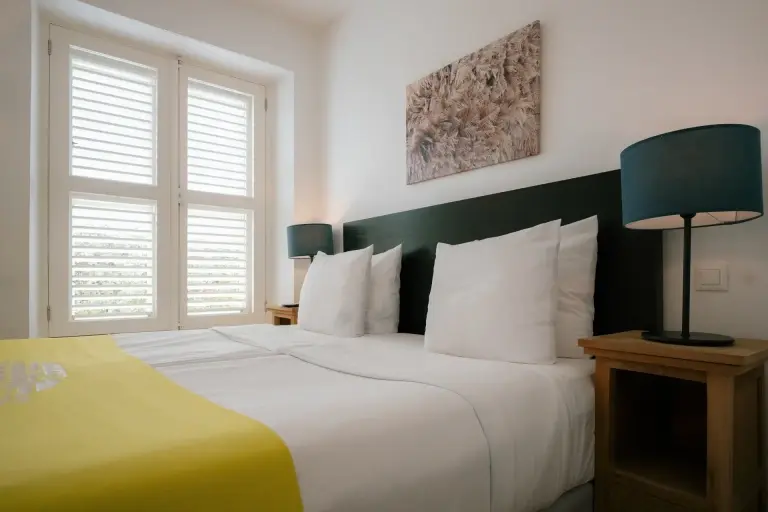 Bedroom in a one-bedroom apartment at Scuba Lodge Boutique Hotel, Curacao.