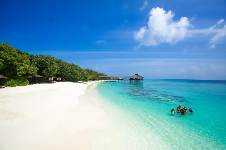 Divers learning how to dive on the beach at Reethi Beach Resort in the Maldives