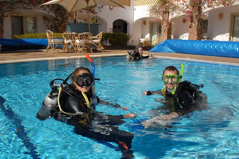 Learning to dive in a swimming pool, Egypt