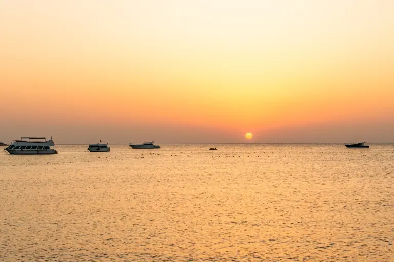 Dive boats at sunset in Makadi Bay, Egypt