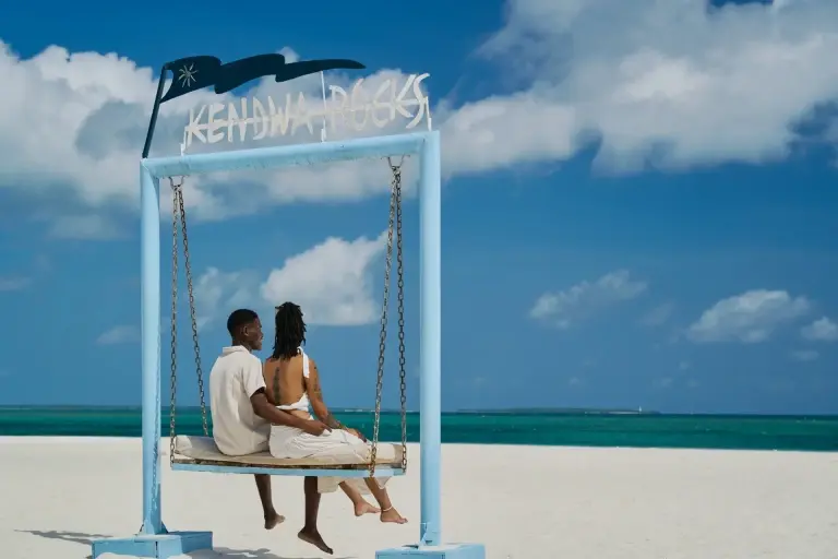 Guests on a swing at the beach, Kendwa Rocks Beach Hotel, Zanzibar